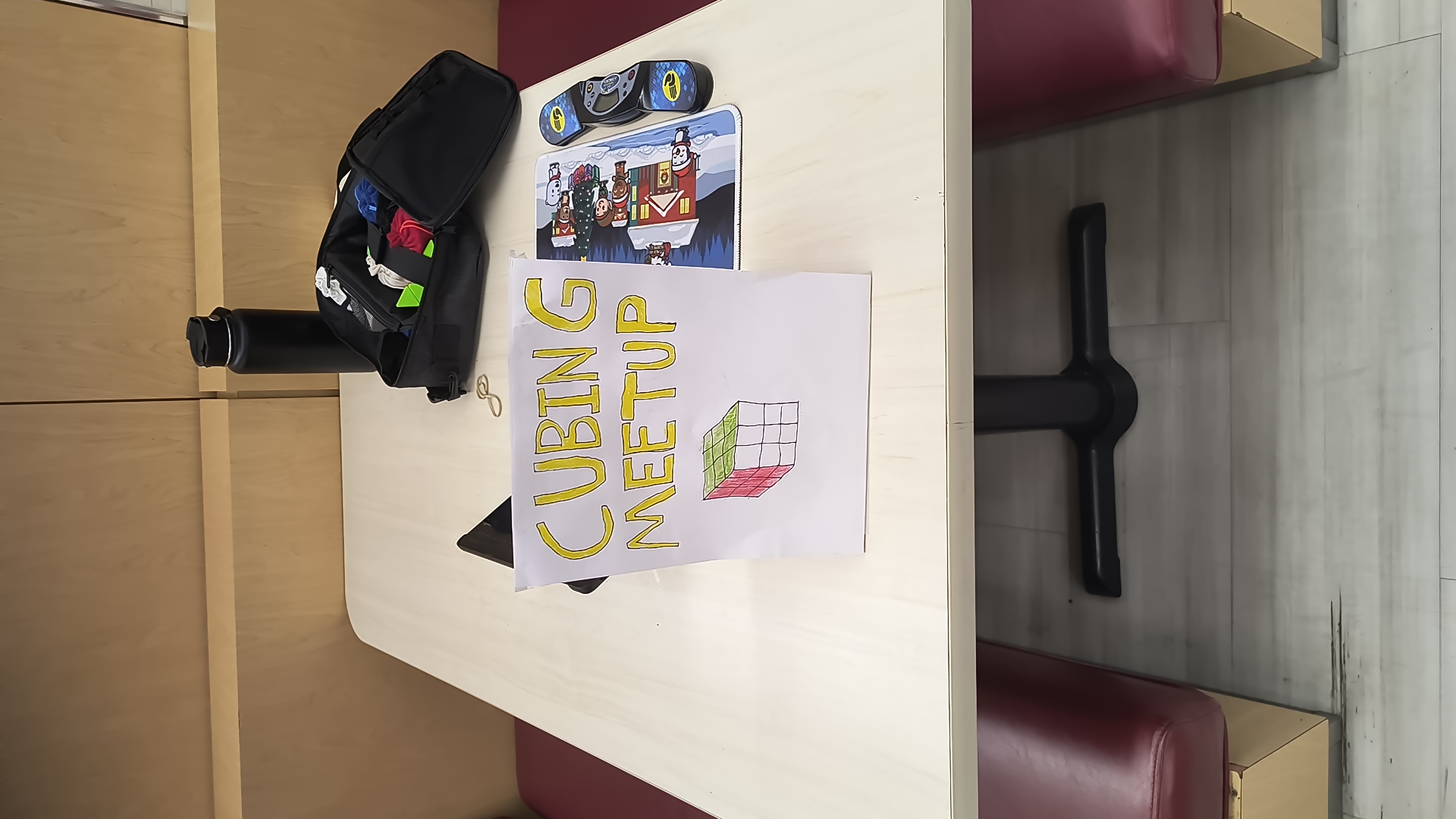 Cubing meetup table with sign and equipment